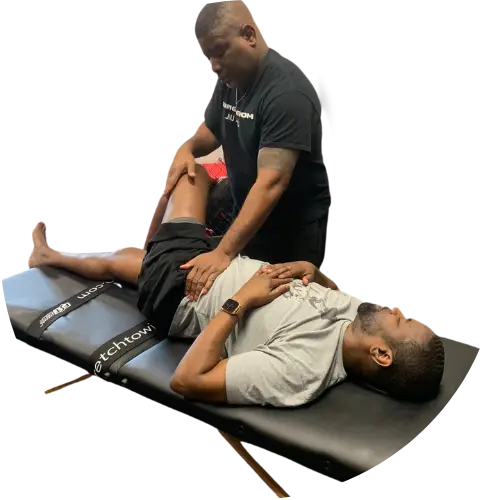 Therapist stretching client